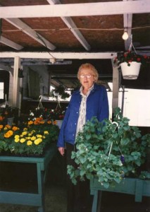 Bill's mom Helen with hanging baskets at the market. We have great hanging baskets available now